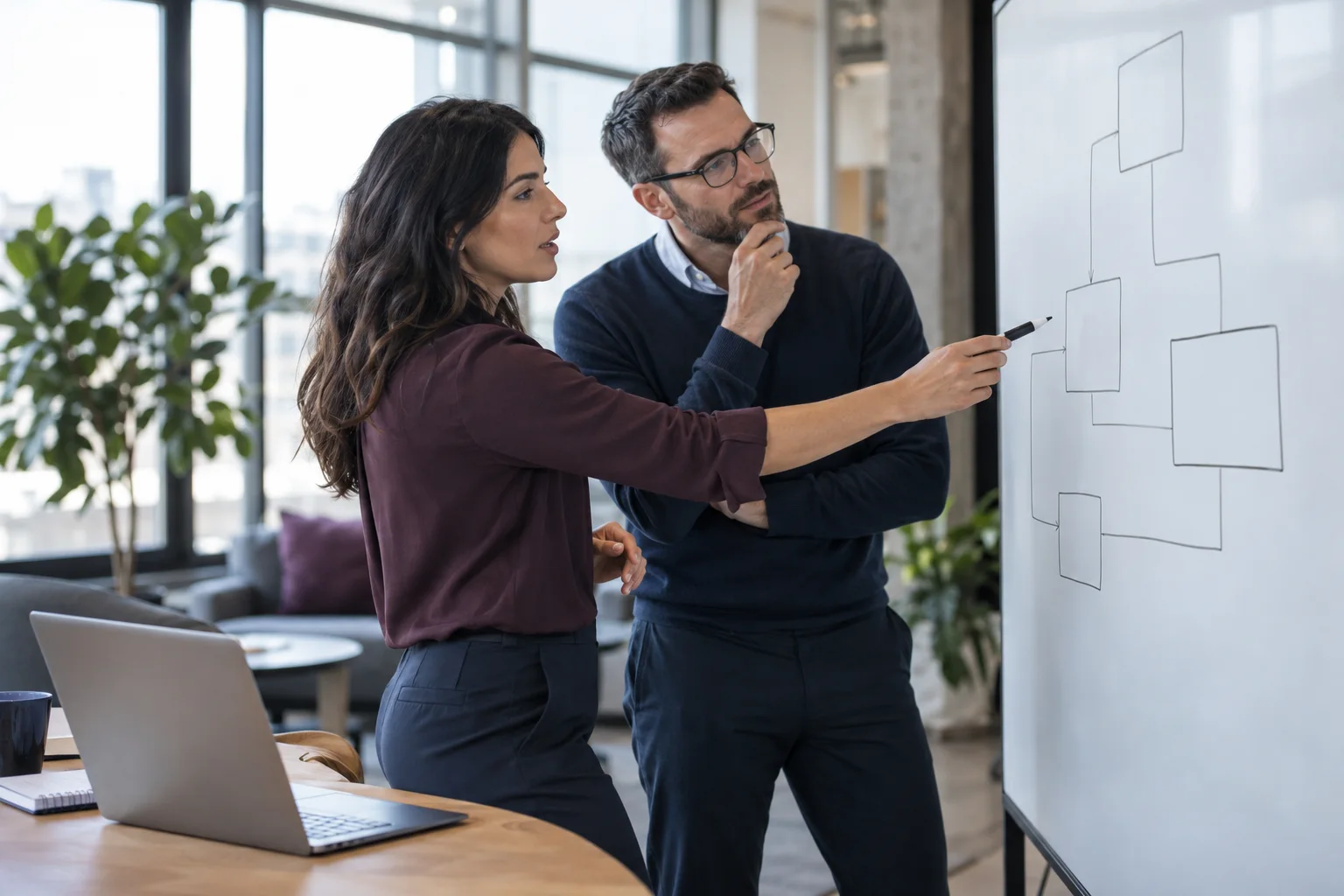 Illustrative revenue operations and technical colleagues reviewing connected workflow shapes